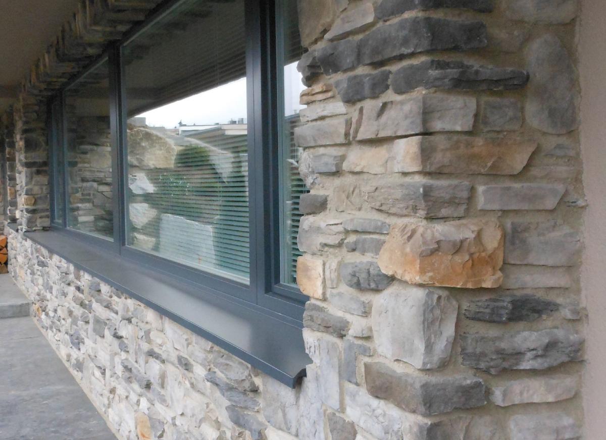 Designing with stone Window ledge with drip feature Custom stone facing